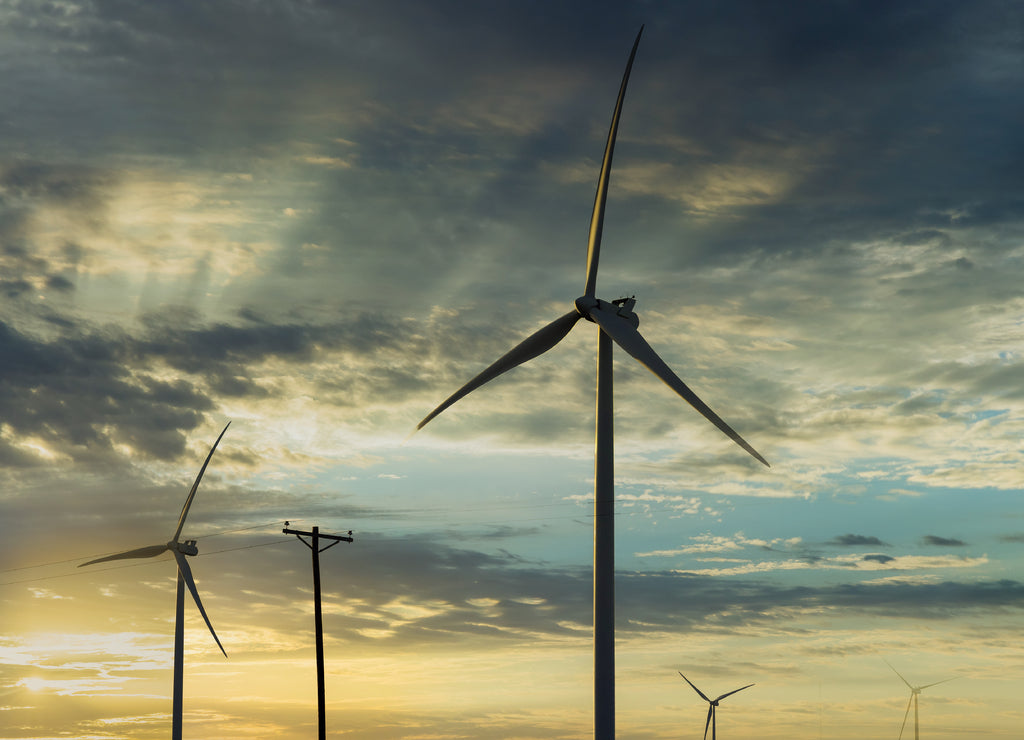 Wind turbines windmill energy farm the beautiful sunset in Texas