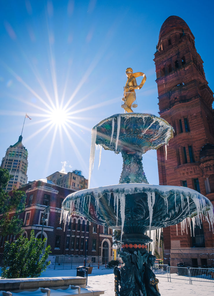 Snow Day at the Bexar County Courthouse in San Antonio Texas. Frozen fountain with icicles at the courthouse