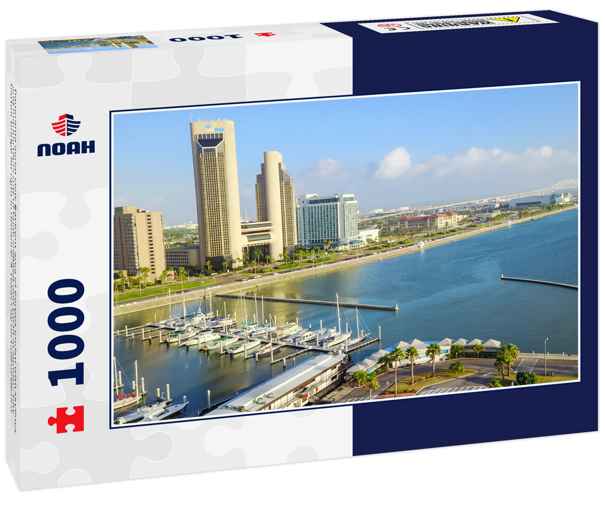 Panorama aerial view Bayfront area of Corpus Christi with skylines and marina piers row of boat, sailboat and yacht at sunrise. City harbor bridge far right in distance. A Texas city on Gulf of Mexico