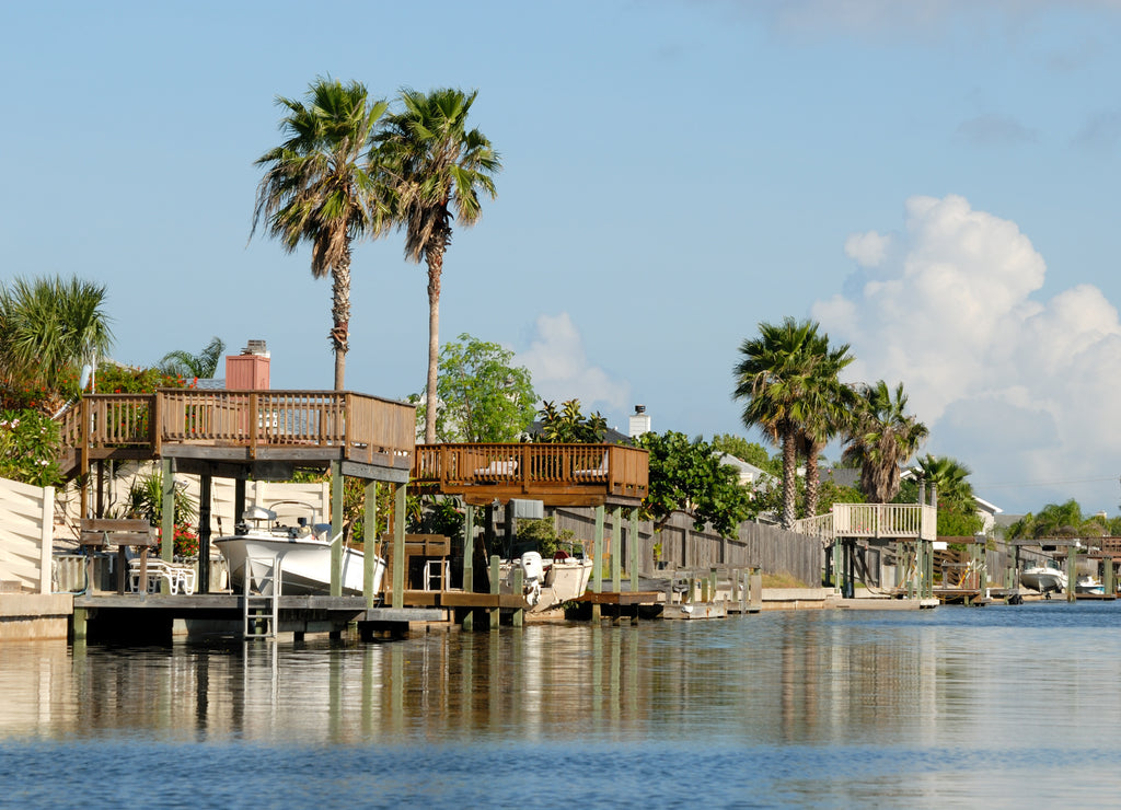 Houses waterside on Padre Island, southern Texas USA