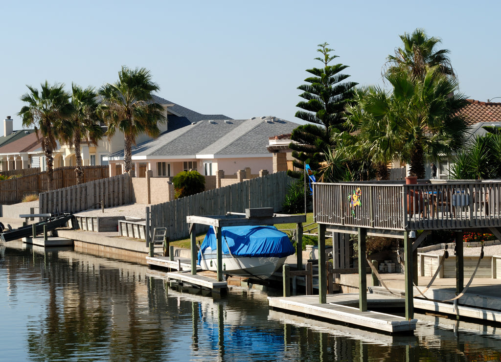 Houses waterside on Padre Island, southern Texas USA