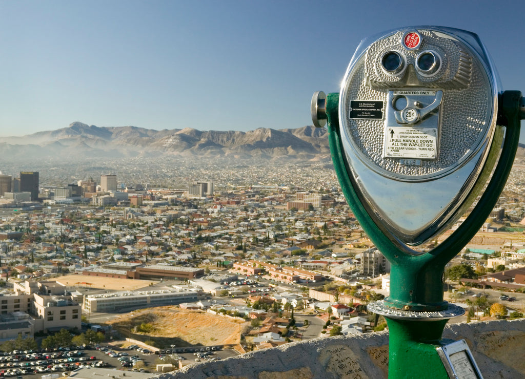 Long range binoculars for tourists and panoramic view of skyline and downtown of El Paso Texas looking toward Juarez, Mexico