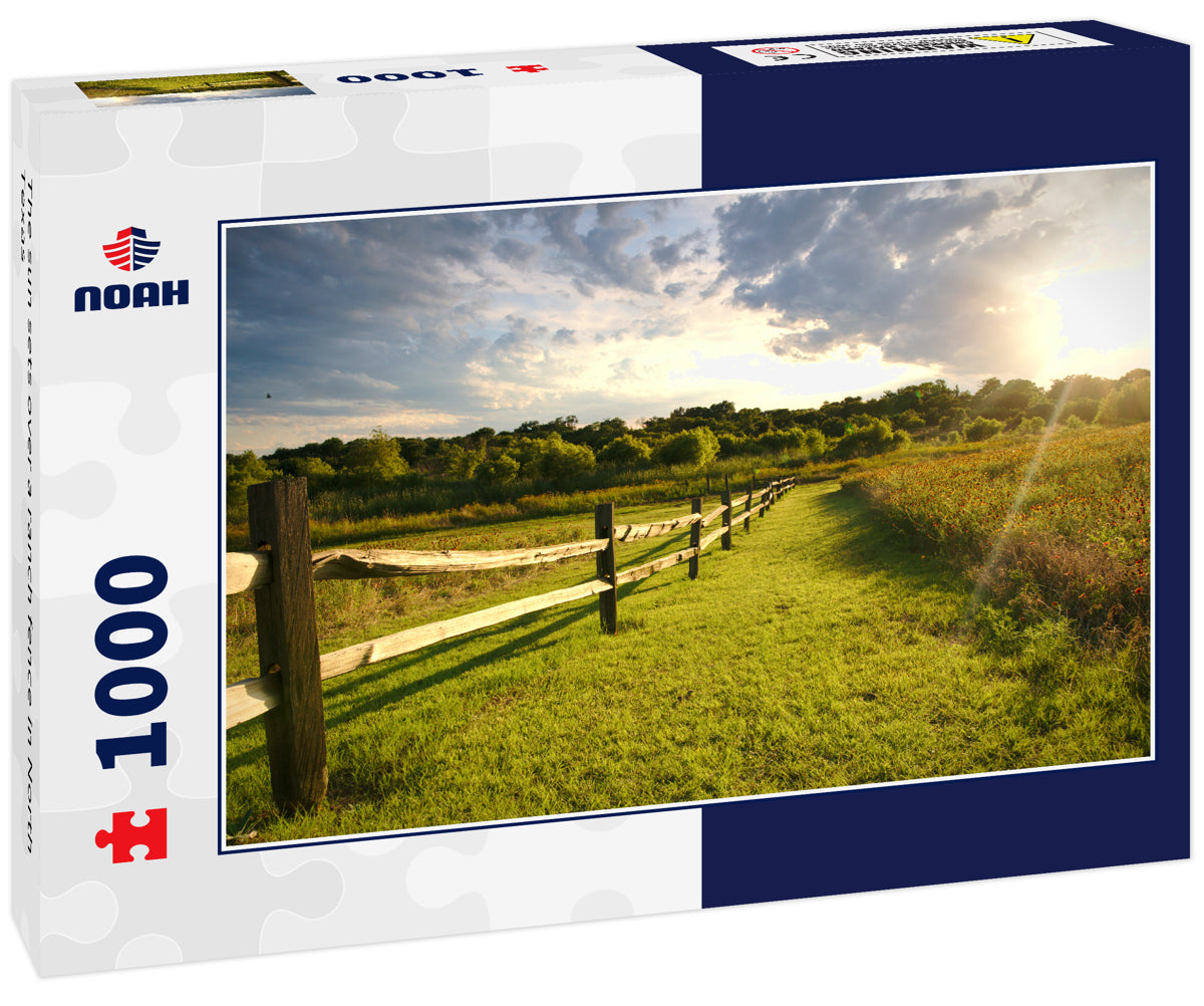 The sun sets over a ranch fence in North Texas
