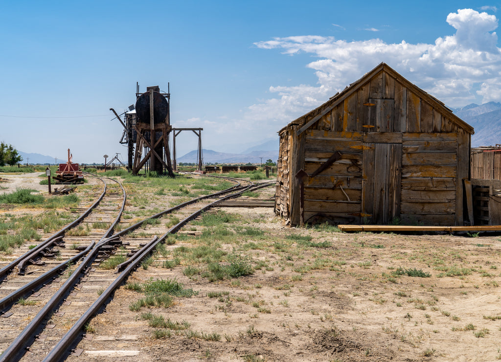 Old abandoned oil well and storage sheds, part of the former Laws Railroad in Inyo County California