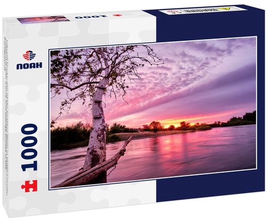 Vibrant landscape of the Feather RIver in Butte County, California with a pink and orange sunset in the background