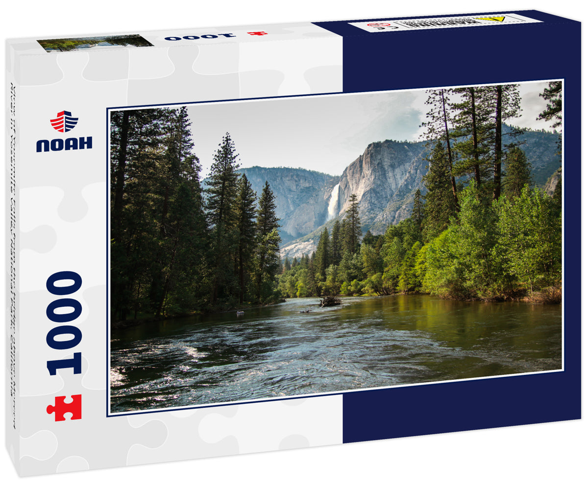 View of Yosemite Falls from the bridge above Merced River in Yosemite Valley National Park, California