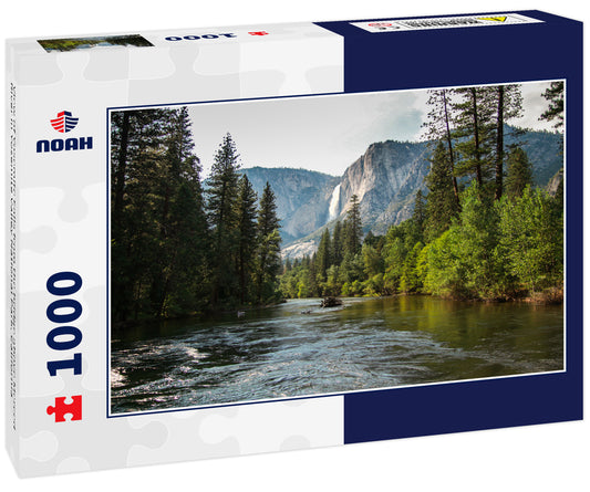 View of Yosemite Falls from the bridge above Merced River in Yosemite Valley National Park, California