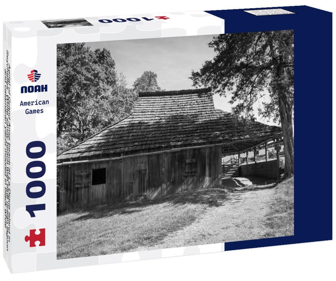 Noah Jigsaw Puzzle Aerial of Grand Anse beach at La Digue island in Seychelles. White sandy beach with blue ocean lagoon and catamaran yacht moored in black white 1000 pieces