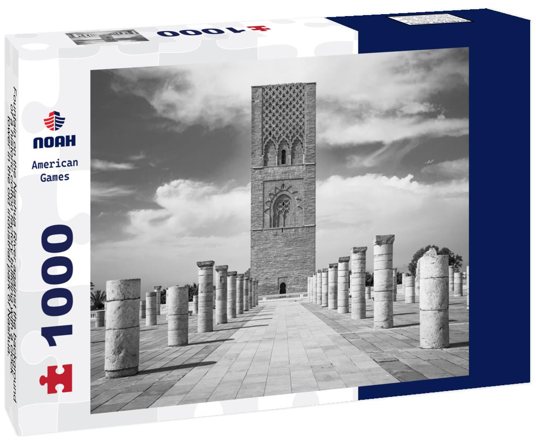 Noah Jigsaw Puzzle Fountain on the Nashua River against the background of a historic cotton factory building with a clock tower in the old industrial park of Nashua. New Hampshire, USA in black white 1000 pieces