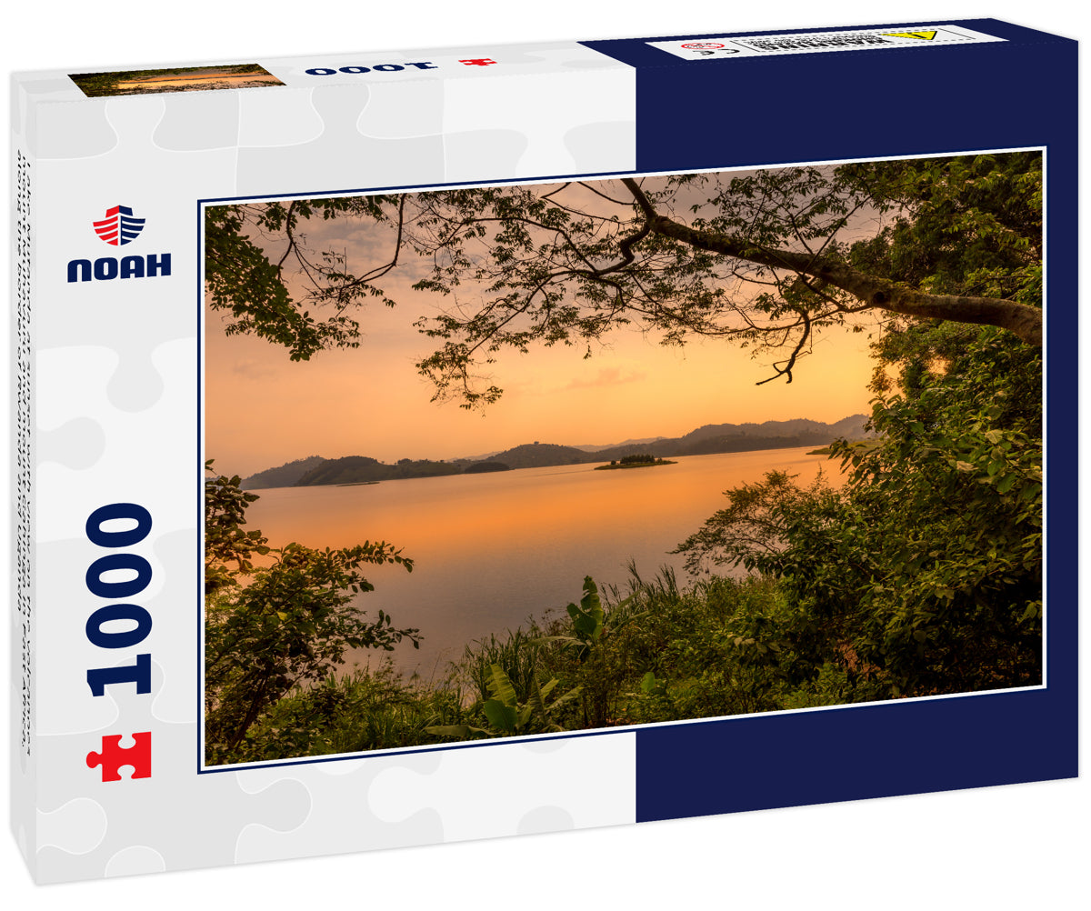 Lake Mutanda at sunset with view on the volcanoes mount Muhavuru and mount Gahinga in East Africa, along the border of Rwanda and Uganda