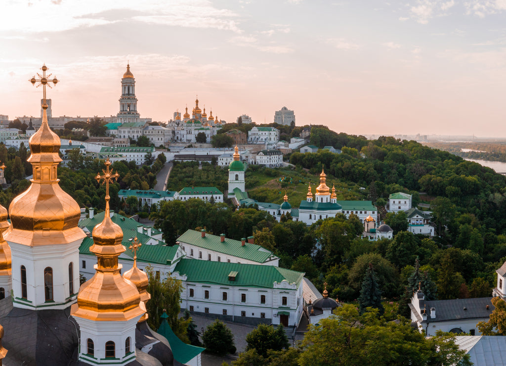 Magical aerial view of the Kiev Pechersk Lavra near the Motherland Monument. UNESCO world heritage in Kyiv, Ukraine. Kiev Monastery of the Caves at sunset