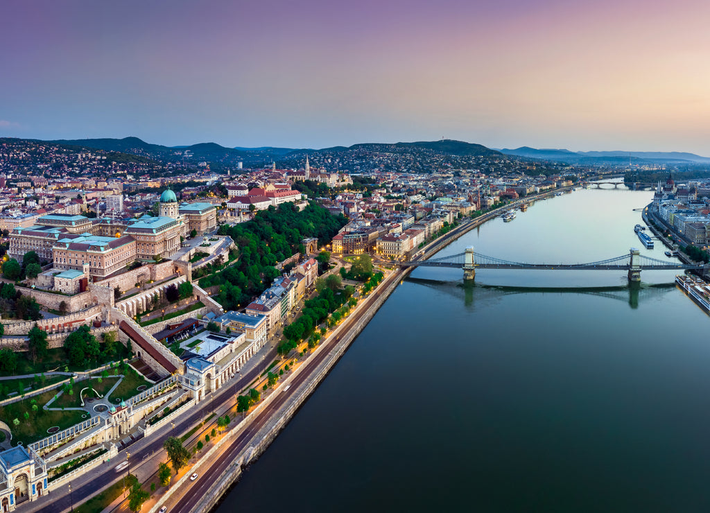 Budapest, Hungary - Panoramic aerial view of Budapest. This view includes Buda Castle Royal Palace, Matthias Churcs, Fisherman's Bastion and Szechenyi Chain Bridge at sunset with colorful sky