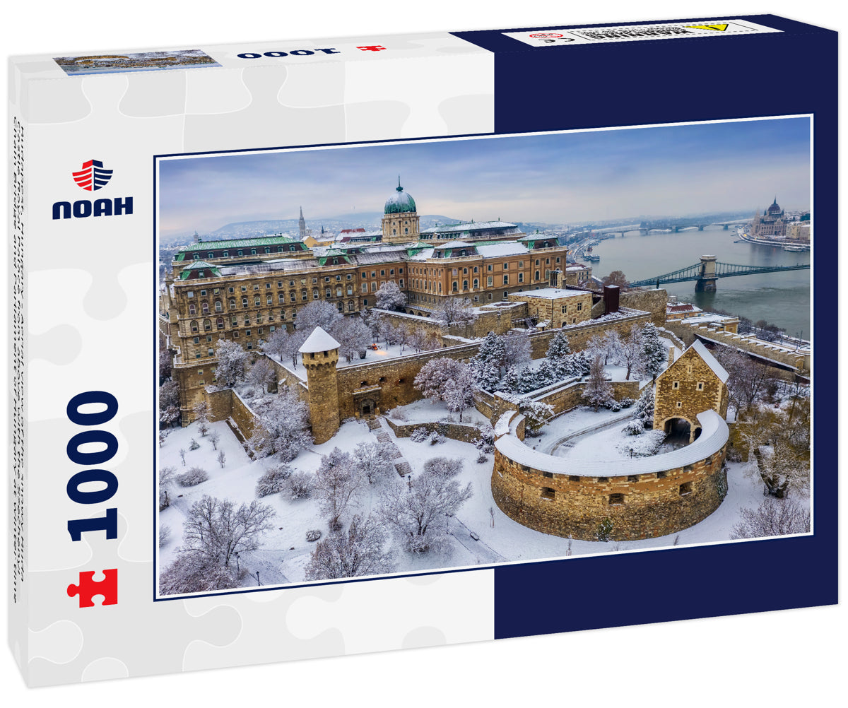 Budapest, Hungary - Aerial view of the snowy Buda Castle Royal Palace from above with the Szechenyi Chain Bridge and Parliament of Hungary at winter time