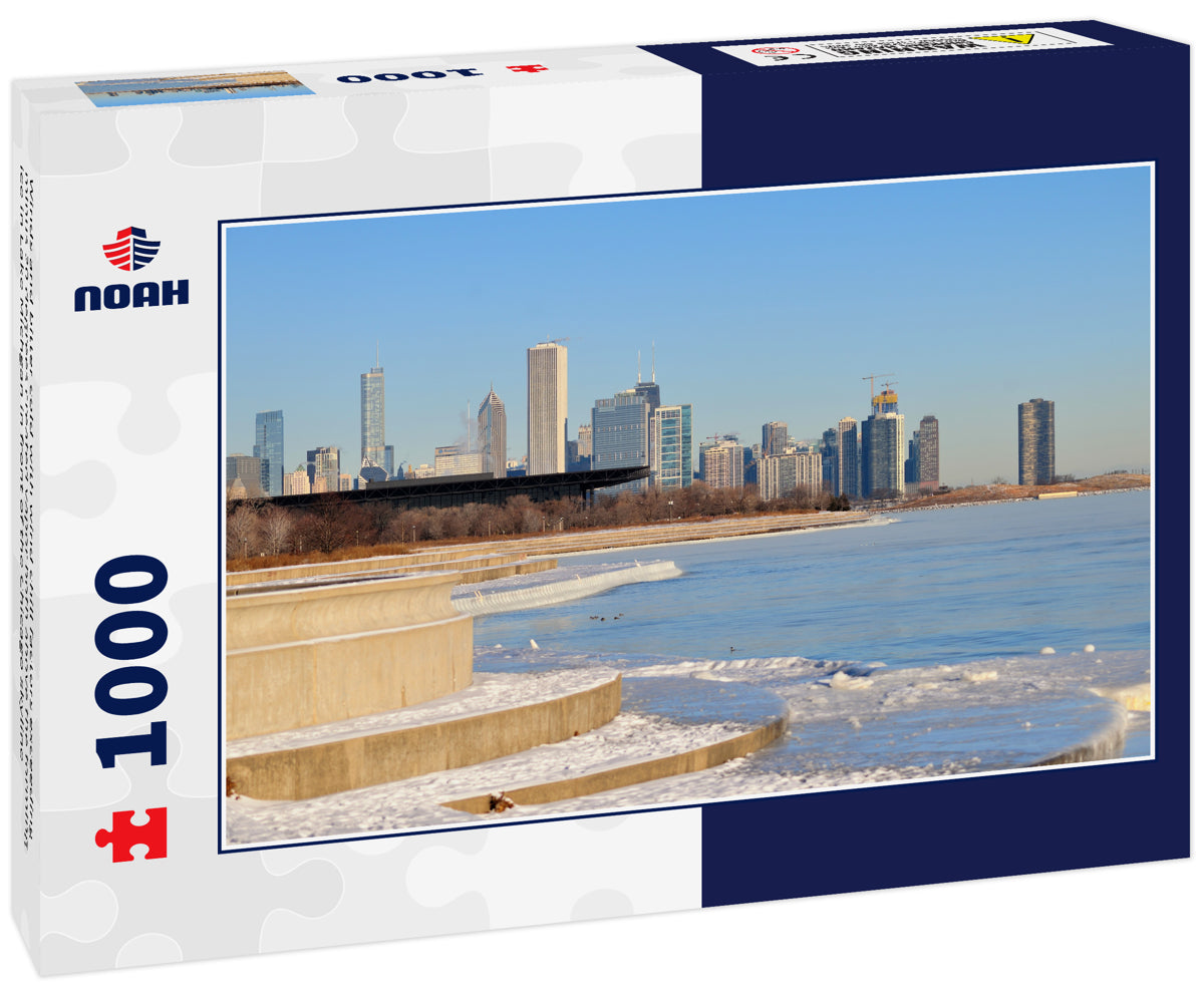 Winds and bitter cold with wind chill factors exceeding minus 20 degrees created vapor both above the forming ice in Lake Michgan in front of the Chicago skyline