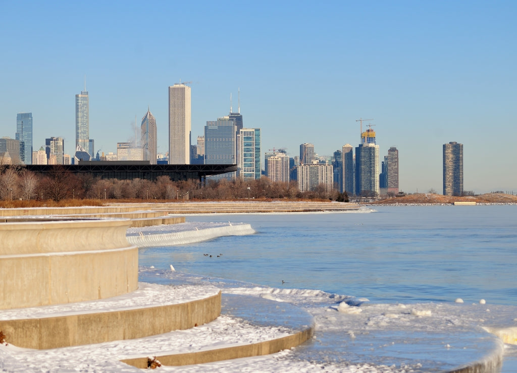 Winds and bitter cold with wind chill factors exceeding minus 20 degrees created vapor both above the forming ice in Lake Michgan in front of the Chicago skyline