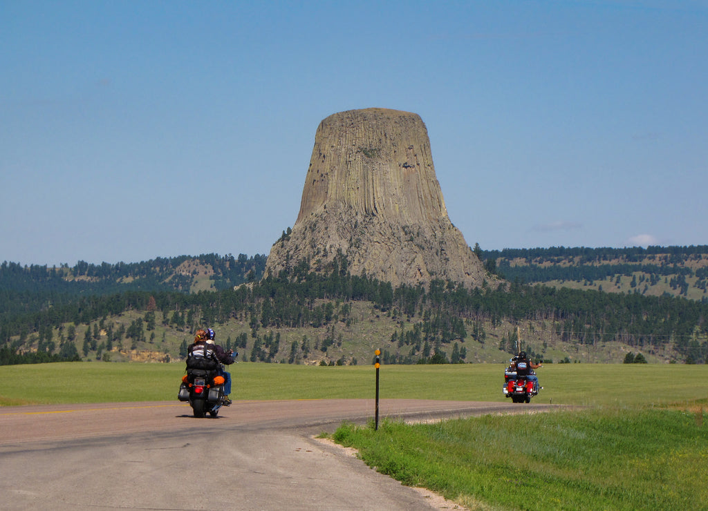 Bikers driving to Devils Tower National Monument at the Sturgis Motorcycle Rally in the Black Hills, Wyoming, USA