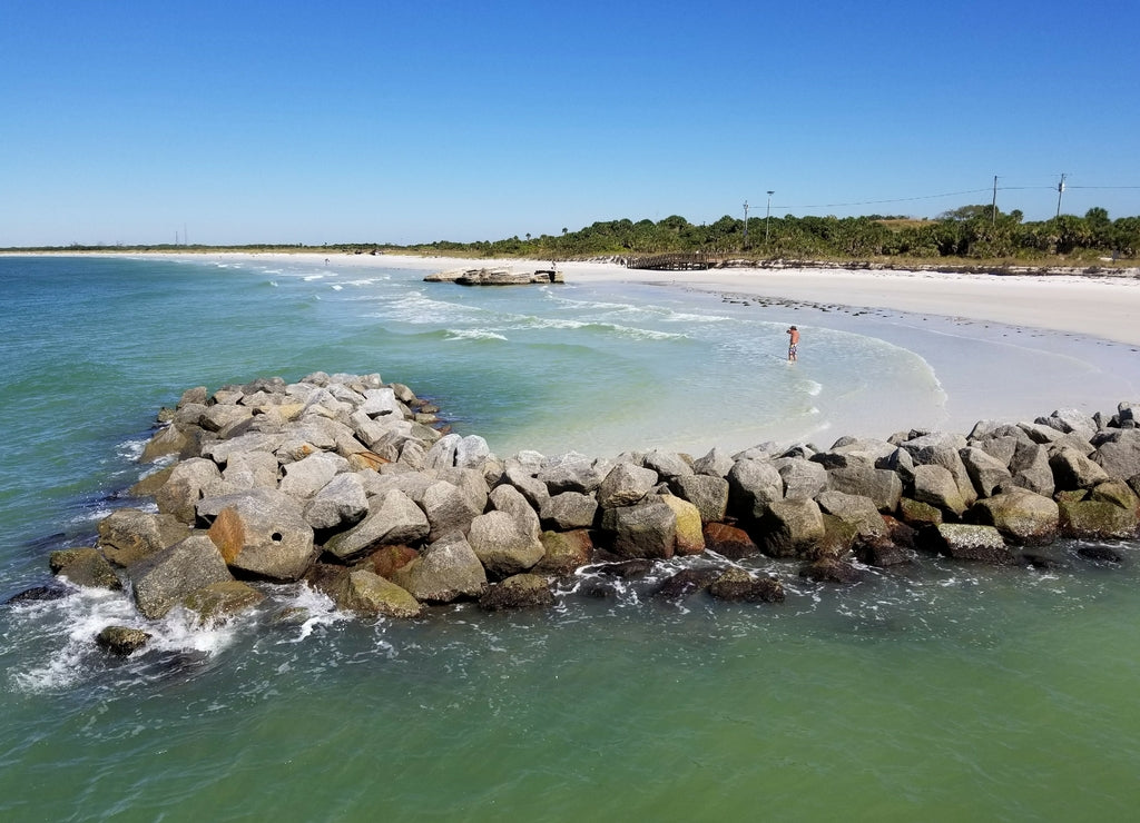The view of beautiful ocean water and rocky beach near Fort Desoto Park, St Petersburg, Florida, U.S.A