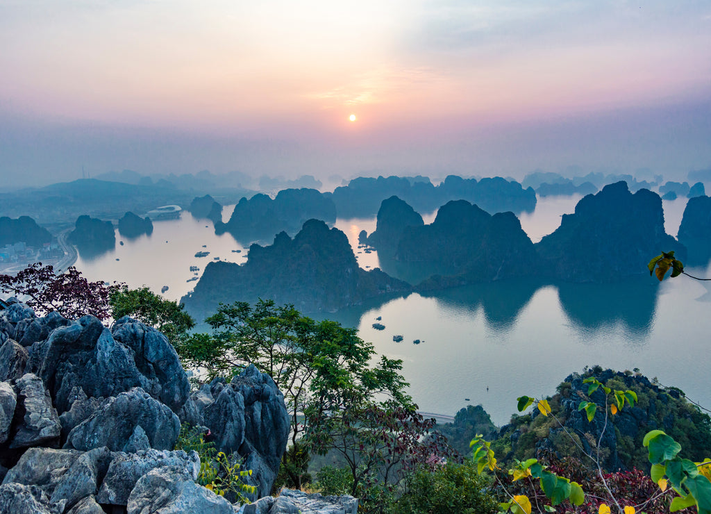 Karst landforms in the sea at the sunrise landscape view from Bai Tho Mountain in Halong Bay, Vietnam, Southeast Asia. UNESCO World Heritage Site