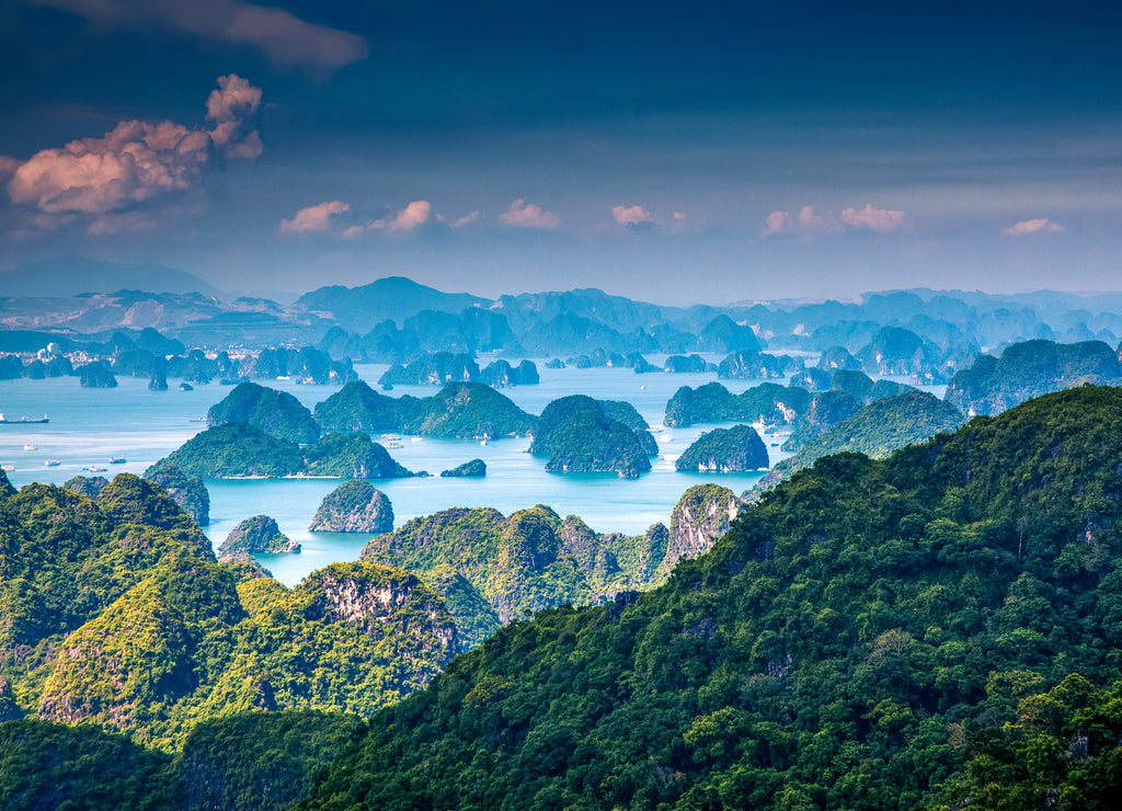 scenic view over Ha Long bay from Cat Ba island, Ha Long city in the background, UNESCO world heritage site, Vietnam