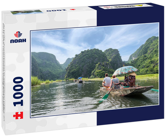 Activity downstream in mountain valley on boat with vietnamese using foot paddle
