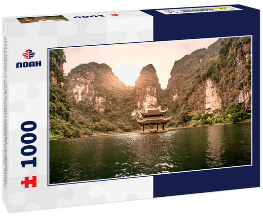 Boat cave tour in Trang An Scenic Landscape formed by karst towers and plants along the river (UNESCO World Heritage Site). It's Halong Bay on land of Vietnam. Ninh Binh province, Vietnam