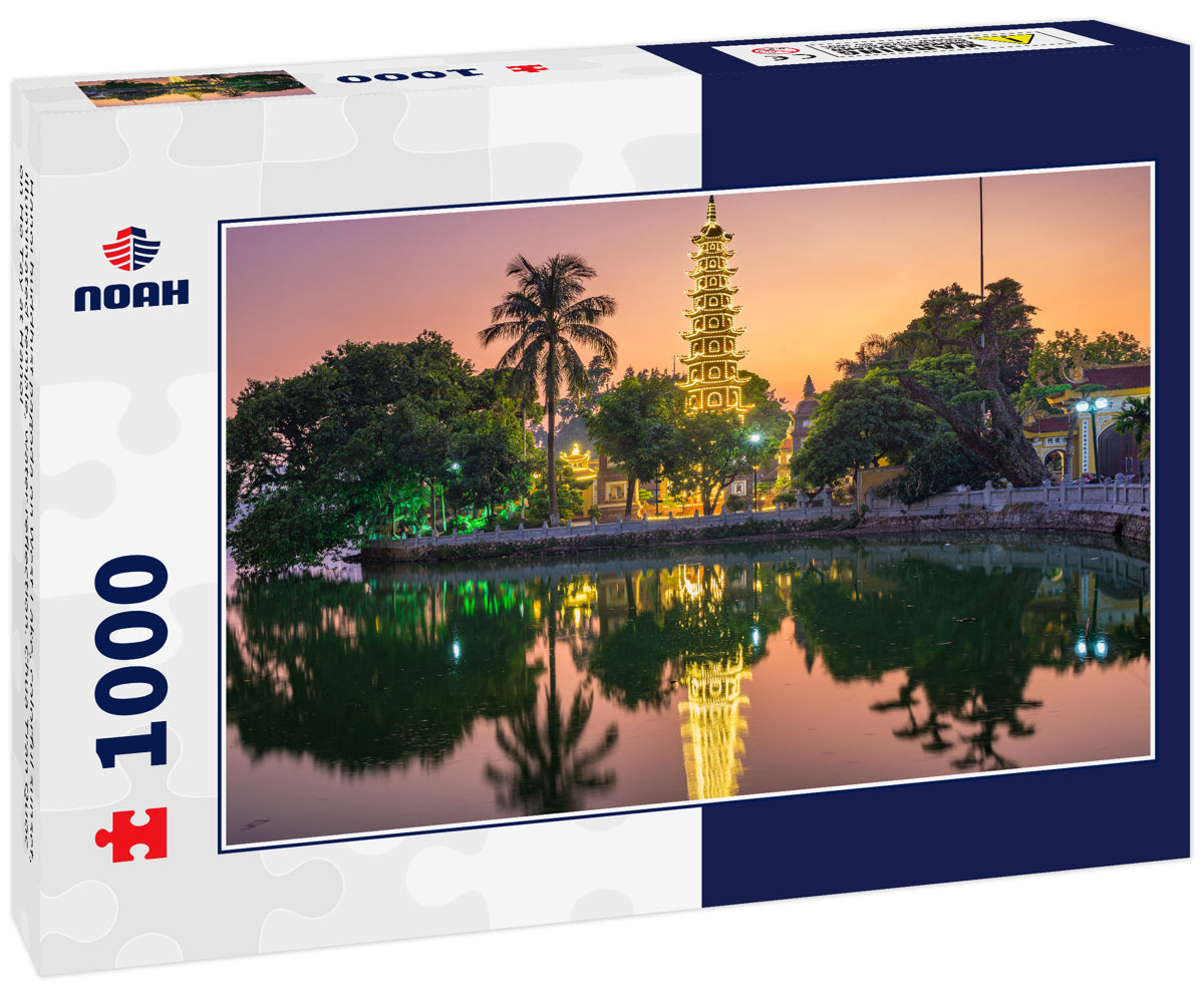 Hanoi buddhist pagoda on West Lake, colorful sunset, illuminated temple, water reflection. Chua Tran Quoc on Ho Tay at Hanoi