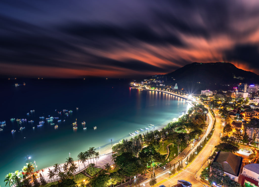 Panoramic coastal Vung Tau view from above, with waves, coastline, streets, coconut trees and Tao Phung mountain in Vietnam