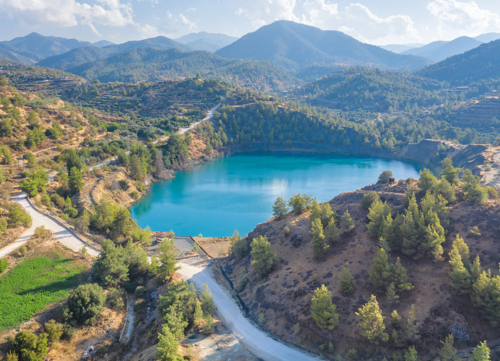 Mine lake from abandoned surface mining in Xyliatos area, Cyprus. Reforestation of old spoil heaps from mining