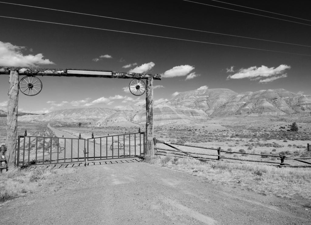 A gate and a fence in desert, wild west, New Mexico in black white