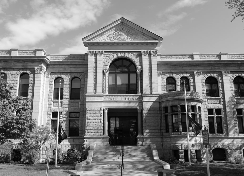 New Hampshire State Library Building was built in 1895 with native granite, in downtown Concord next to the State Capitol, State of New Hampshire, USA in black white