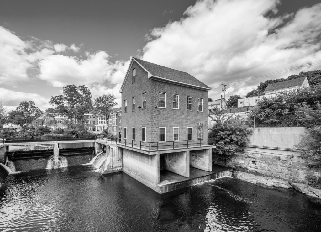 Historic buildings along the Winnipesaukee River, in Laconia, New Hampshire in black white