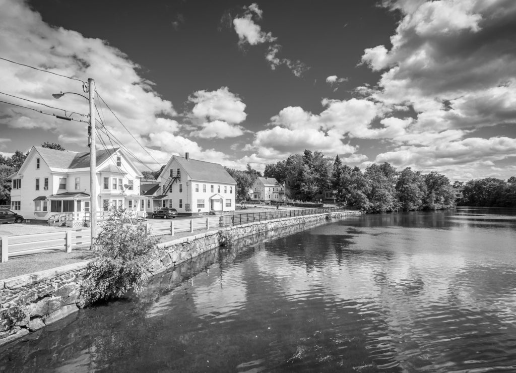 Houses along the Winnipesaukee River, in Laconia, New Hampshire in black white