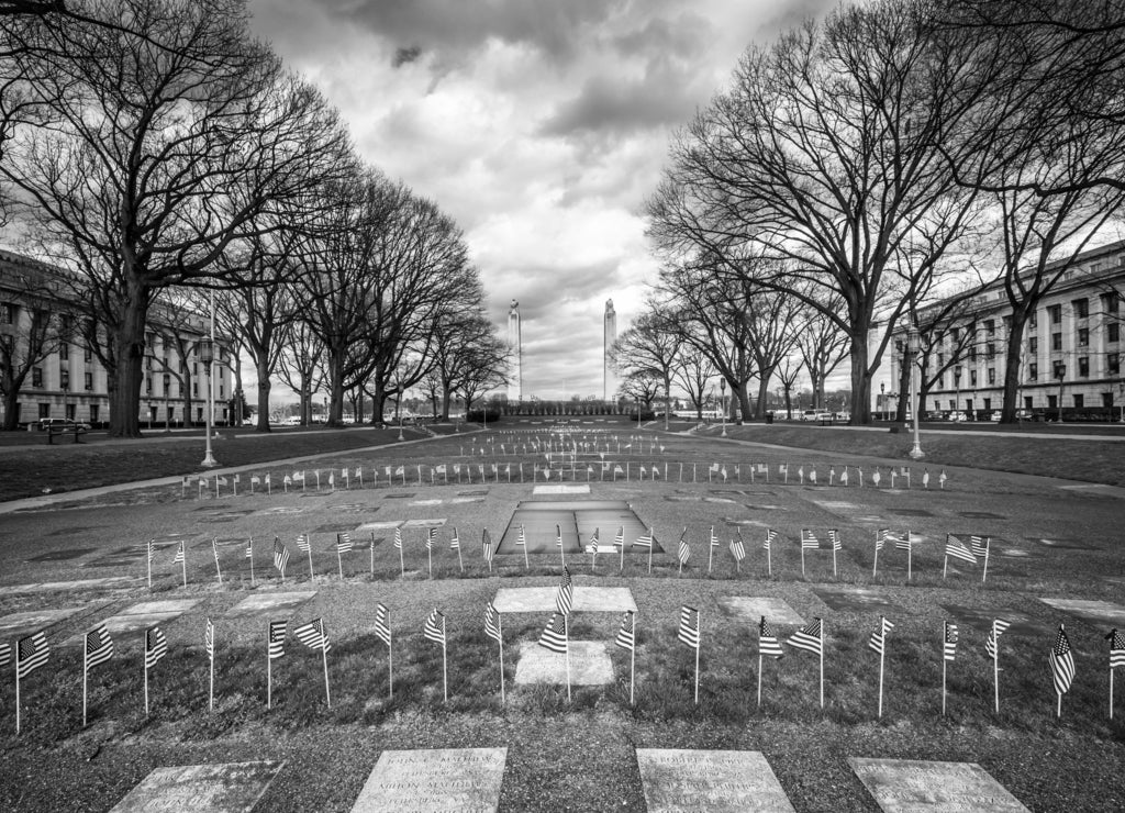 Memorials and small American flags at the Pennsylvania State Cap in black white