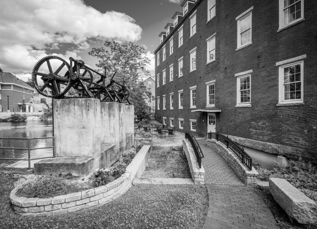The Busiel Mill Building and Winnipesaukee River, in Laconia, New Hampshire in black white