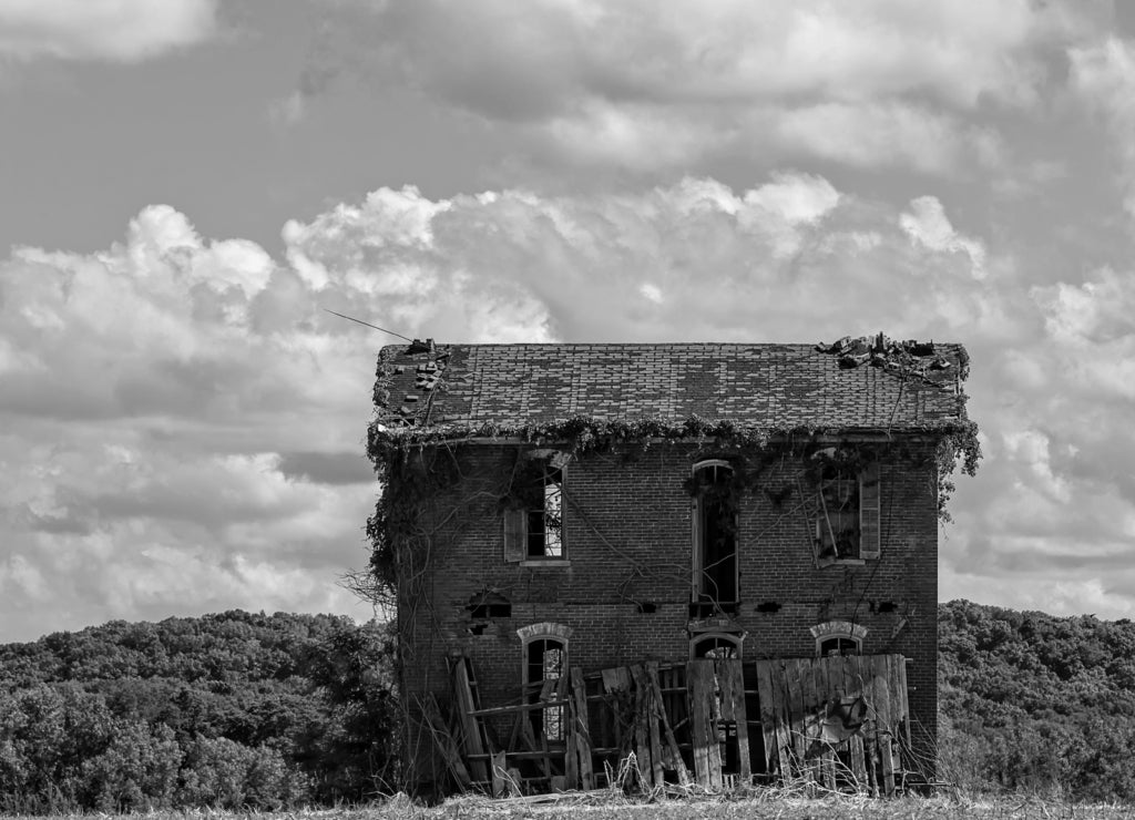Old abandon farm house on Rt. 79, 5 miles north of Louisiana Missouri in black white