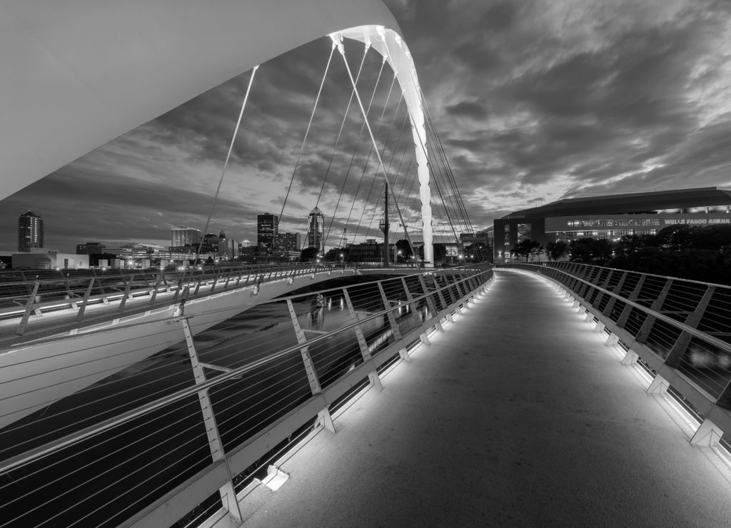 Women of Achievement Bridge, links the east and west sides of Des Moines at the northern edge of the Principal Riverwalk loop, Iowa USA in black white