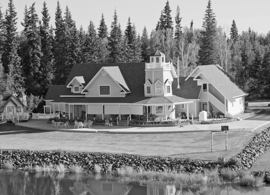 Beautiful home along the river in Fairbanks, Alaska in black white