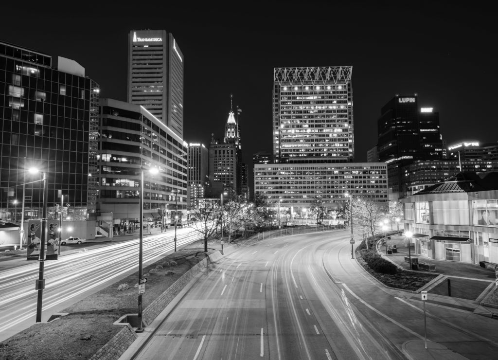 Light Street and the skyline of downtown at night, in Baltimore, Maryland in black white