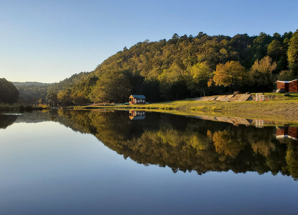 Forest tree's reflection on Broken Bow lake water in Hochatown Oklahoma