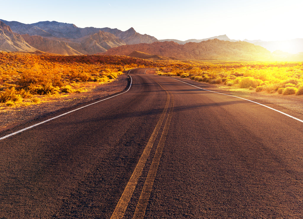 Red sunset over road at Valley of Fire State Park, southern Nevada, USA