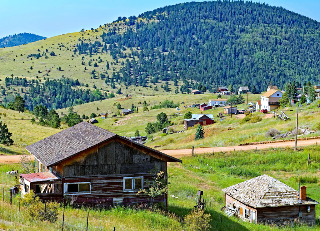 Abandoned and occupied properties outside Cripple Creek, Colorado, U.S.A., a reminder of its gold mining boom town past