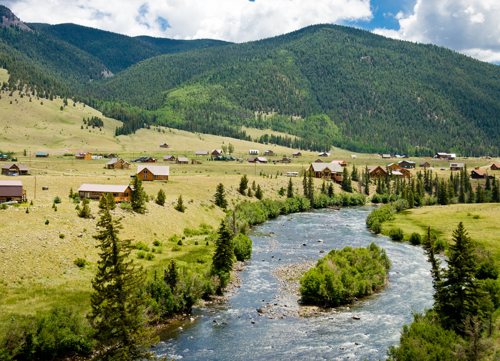 Willow Creek Creed Colorado - Homes along Willow Creek outside the town of Creede in Mineral County Colorado with the forest covered mountains in the background