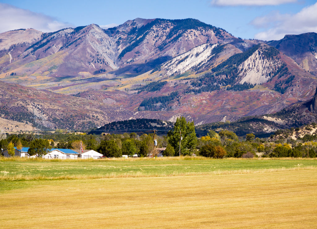 Youngs Peak Crawford Colorado - Youngs Peak in farming community of Crawford, Colorado with mountains in background, Delta County