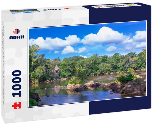 River view of a castle overlook on the Ocmolgee River in Macon, Georgia at Amerson Park with white puffy clouds and blue sky