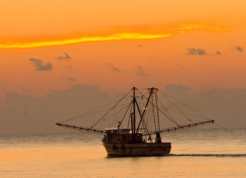 A shrimp boat off St Simons Island, Georgia at sunset