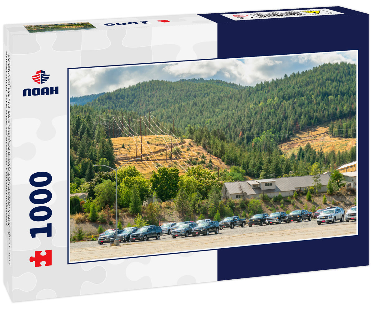 Rows of new cars underneath the mountain ski resort of Silver Mt. in the city of Kellogg Idaho, USA, a Superfund site due to ground contamination