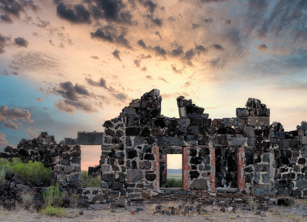 Idaho desert stone building ruins at sunset