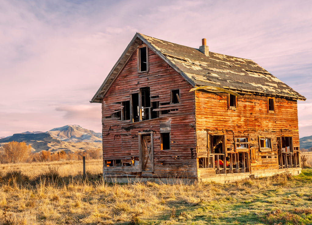 Forgotten homestead in Idaho at sunset