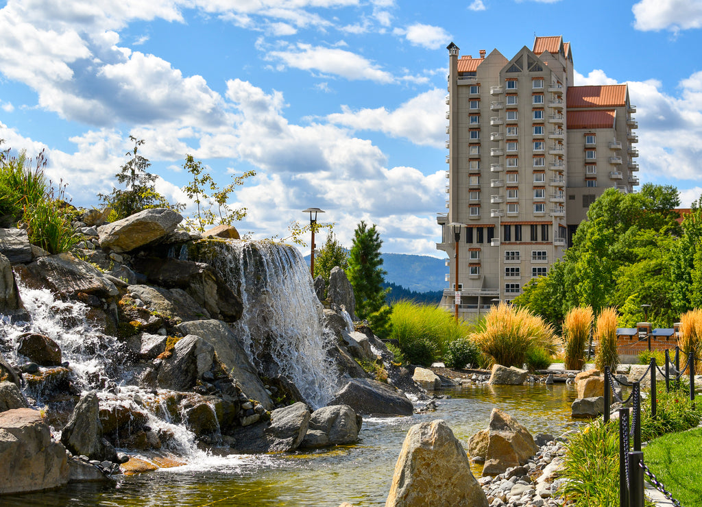 A landscaped waterfall and pond in the public McEuen Park near the resort in the lakeside town of Coeur d'Alene Idaho USA