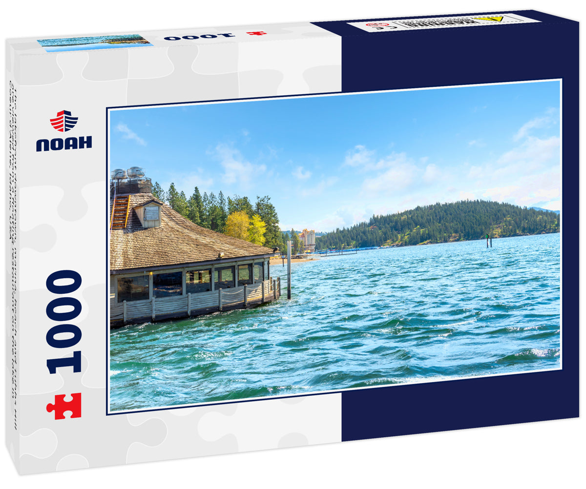 The lakefront downtown, marina, beach and Tubbs Hill are viewed from a floating restaurant on the lake in Coeur d'Alene, Idaho, USA